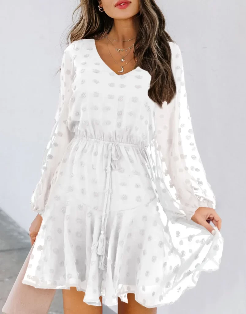 Vestido elegante blanco, tela de lunares. estilo evasé, con mangas abullonadas, falda amplia y fino cordón con borlas en la cintura. Vestidos de moda de lunares casuales y elegantes.